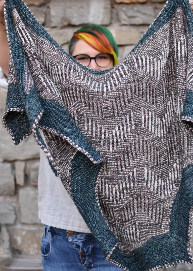 Ewe York hand-knit triangle Shawl in light gray, brown and teal, knit in two-color brioche and garter stitch with a graphic two-color chevron brioche design.