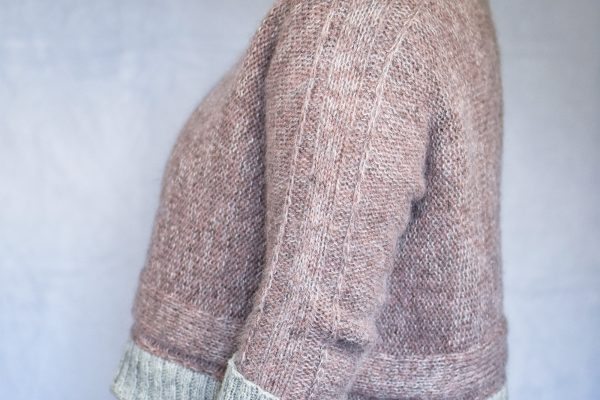 Hazy Lanes cropped sweater knit sideways in dusty pink wool and mohair with silver gray ribbed cuffs and hem.