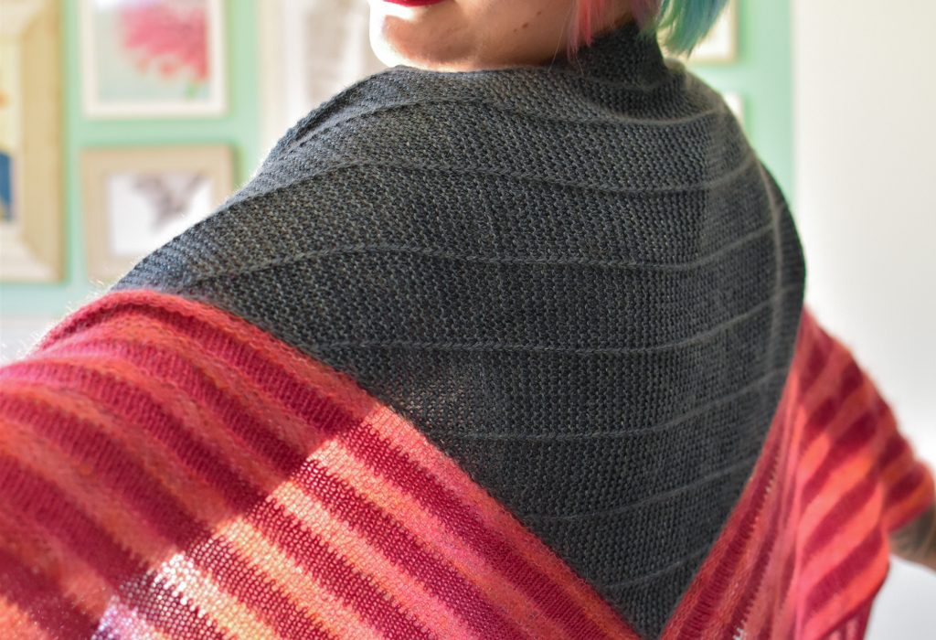 Stay At Home triangle shawl in dark green center panel and pink wool and mohair lace stripes.