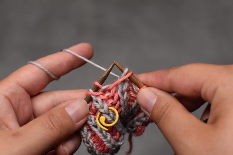 Step 1: Slip stitch (and its yarn-over) knit-wise.