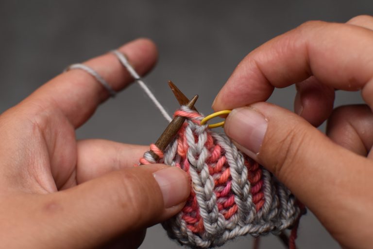 Step 10: Place stitch from stitch marker back onto left-hand needle and remove the marker.