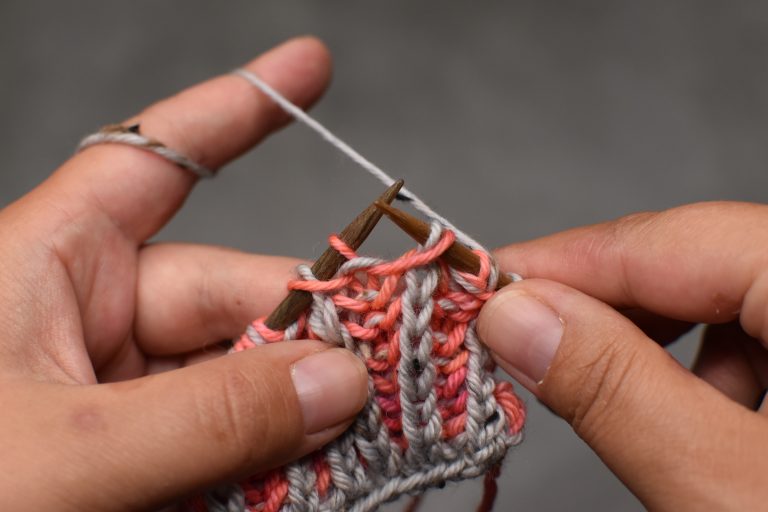 Step 1: Slip stitch (and its yarn-over) knit-wise onto right-hand needle.