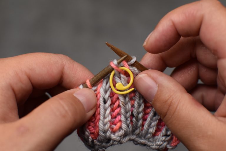 Step 10: Lift stitch from stitch marker back onto left-hand needle and remove the stitch marker.