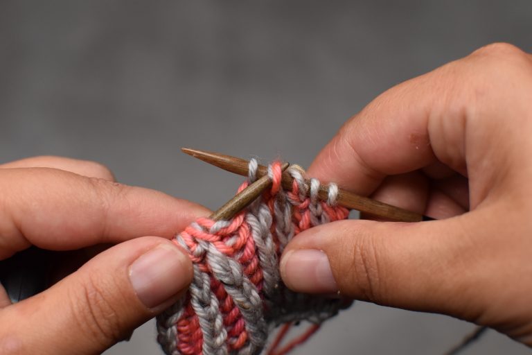Step 3: Pass the slipped stitch (and its yarn-over) over and off the needle.