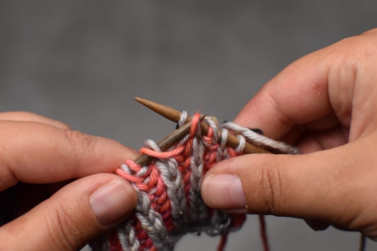 Step 3: Pass the slipped stitch (and its yarn-over) over and off the needle.