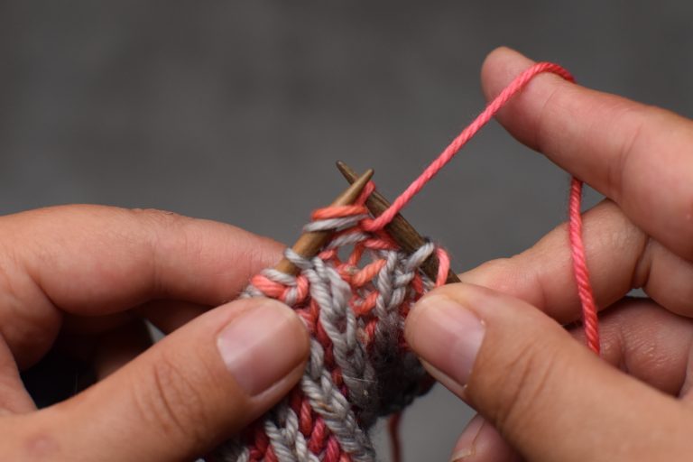 Step 1: Brioche purl the stitch, but leave it on the left-hand needle.